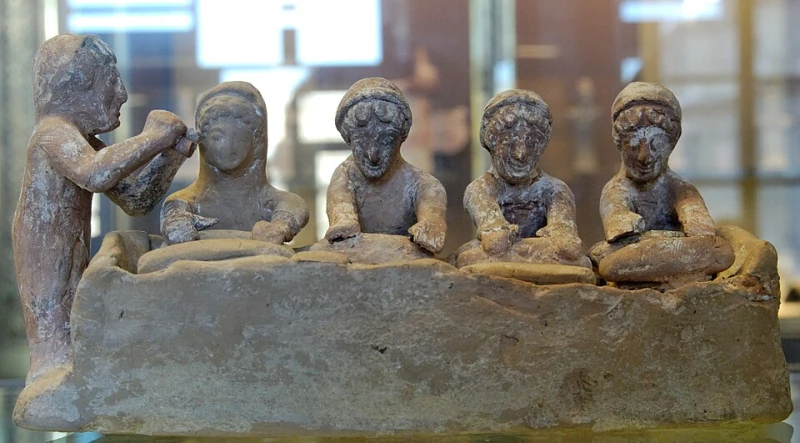 Group of figurines: women kneading dough with a flute-player — Boeotian Greek (unknown maker), from Thebes, Musée du Louvre, Paris